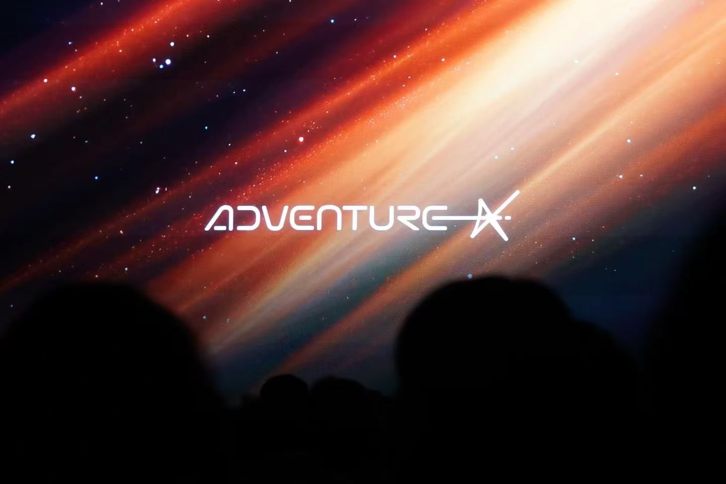 AdventureX stage screen above audience silhouettes